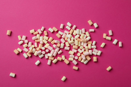 Sweet marshmallow on pink background, top viewの写真素材