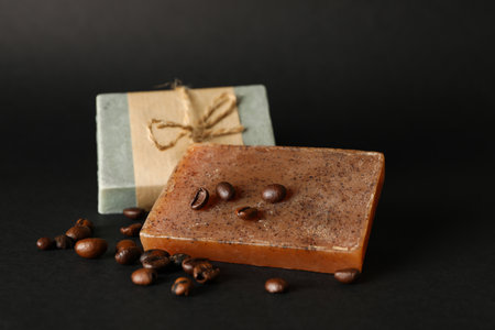 Natural soap and coffee seeds on black backgroundの写真素材