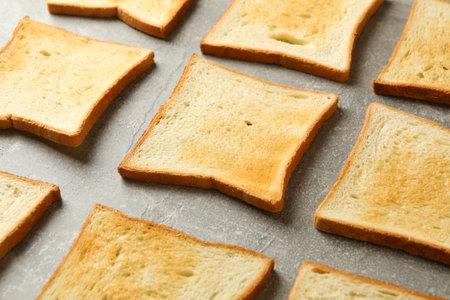 Flat lay with toast breads on gray background