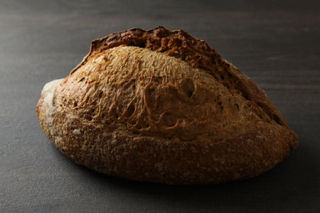 Fresh baked rye bread on black background