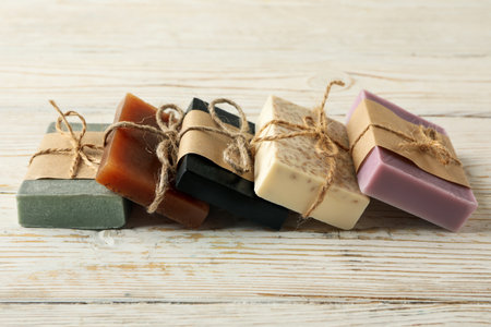 Pieces of natural handmade soap on wooden backgroundの写真素材