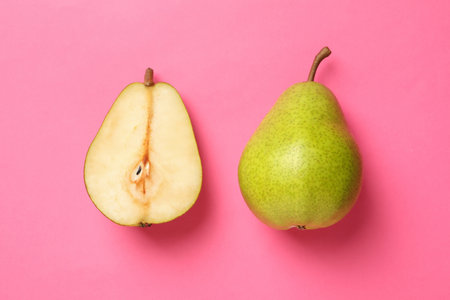 Fresh green pears on pink background, close upの写真素材
