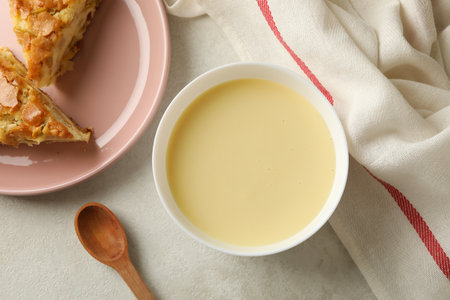 Concept of tasty lunch with bowl of condensed milkの写真素材