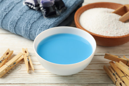 Laundry accessories on white wooden background, close upの写真素材