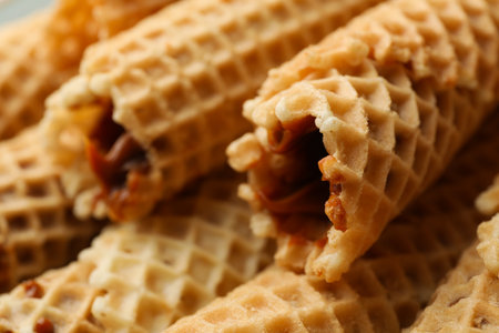 Tasty wafer rolls with condensed milk, close upの写真素材