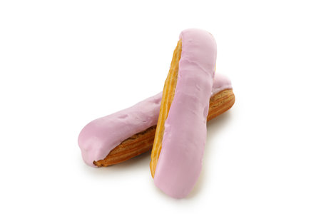 Delicious eclairs with custard isolated on white backgroundの写真素材
