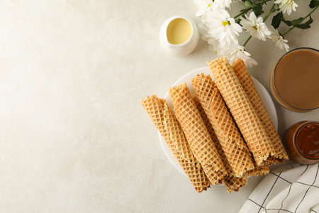 Concept of tasty breakfast with wafer rolls with condensed milk