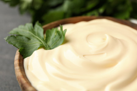 Bowl with mayonnaise sauce and parsley, close upの写真素材