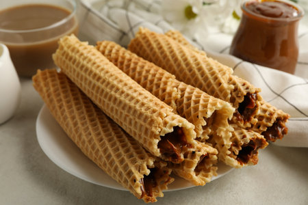 Concept of tasty breakfast with wafer rolls with condensed milkの写真素材