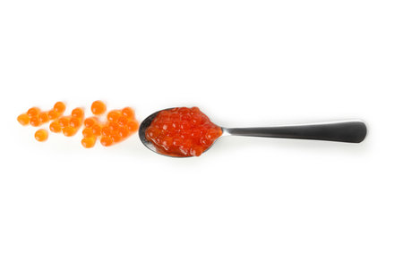 Spoon with red caviar isolated on white backgroundの写真素材