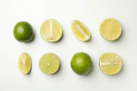 Flat lay with ripe lime on white background