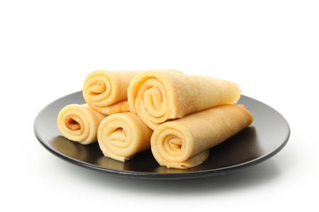 Plate with thin pancakes isolated on white backgroundの写真素材