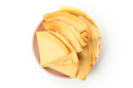 Plate with thin pancakes isolated on white backgroundの写真素材