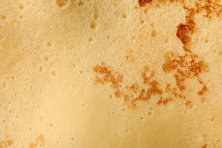 Delicious thin pancake texture background, close up