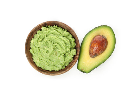 Bowl of guacamole and avocado isolated on white backgroundの写真素材