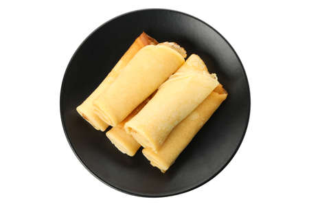 Plate with thin pancakes isolated on white background