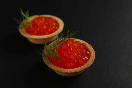 Tartlets with caviar on black background, close upの写真素材