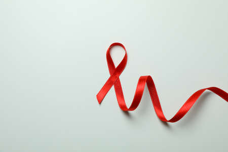 Red awareness ribbon on white background, space for textの写真素材