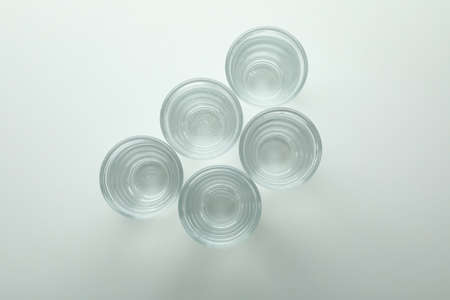 Shots of vodka or tequila on white backgroundの写真素材