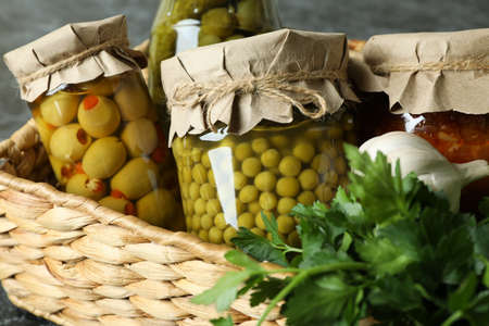 Basket with pickled food and ingredients, close upの写真素材