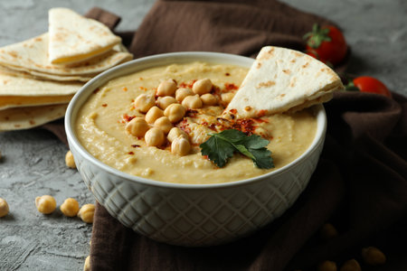 Concept of tasty eat with hummus and pita on gray backgroundの写真素材