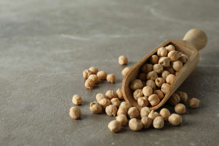 Scoop with fresh chickpea on gray backgroundの写真素材