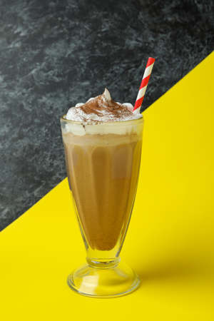 Glass of chocolate milkshake on two tone backgroundの写真素材
