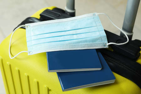 Travel bag with passports and medical mask