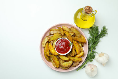 Concept of tasty meal with potato wedges on white backgroundの写真素材