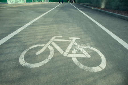 Symbol to indicate the road for bicycles on asphaltの写真素材