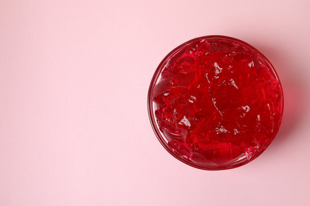 Bowl of red jelly on pink backgroundの写真素材
