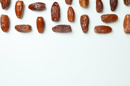 Flat lay with tasty dates on white background, space for textの写真素材