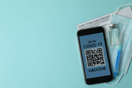 Concept of vaccination with  QR code on blue background