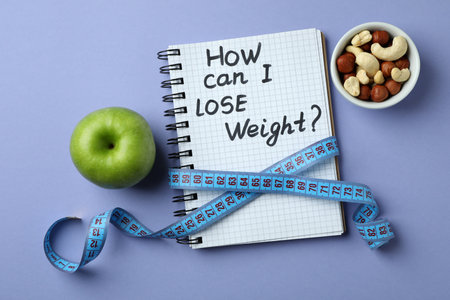 Weight loss concept on violet background, top viewの写真素材