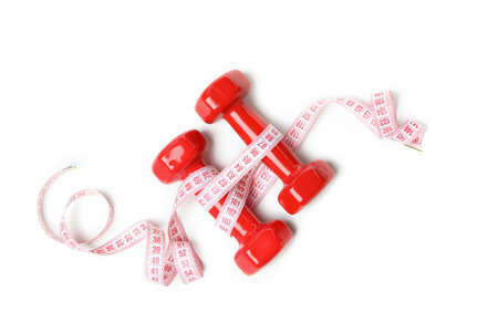 Dumbbells with measuring tape isolated on white background