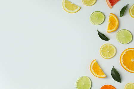 Fresh citrus slices on white background, space for textの写真素材