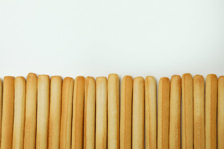 Grissini breadsticks on white background, space for textの写真素材