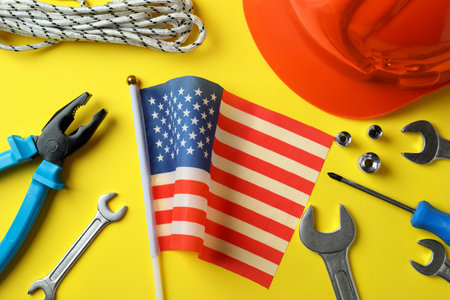 Concept of Happy Labor Day with different accessories on yellow backgroundの写真素材