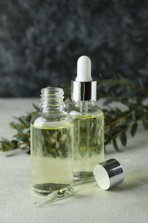 Concept of natural cosmetics with eucalyptus oil on white textured tableの写真素材
