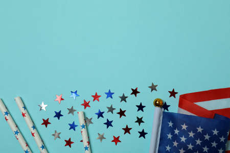 American flag, glitter and straws on blue backgroundの写真素材