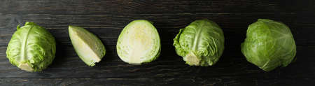Fresh green cabbage on wooden table, top viewの写真素材