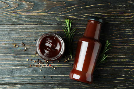Barbecue sauce and spices on wooden tableの写真素材