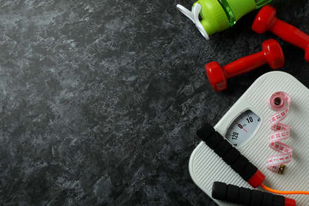 Weight loss concept on black smoky background, space for text