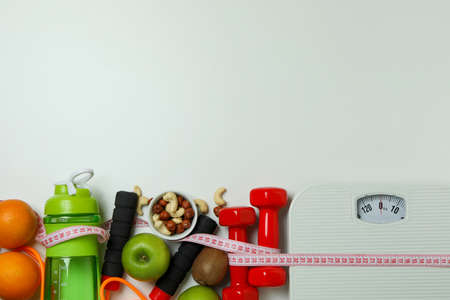 Weight loss accessories on white background, space for textの写真素材