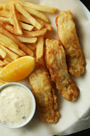Plate with tasty fried fish and chips, close upの写真素材