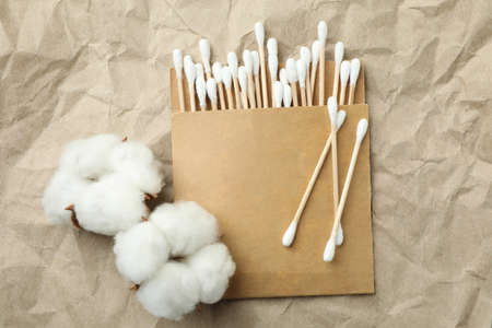 Cotton swabs and cotton on craft paper backgroundの写真素材