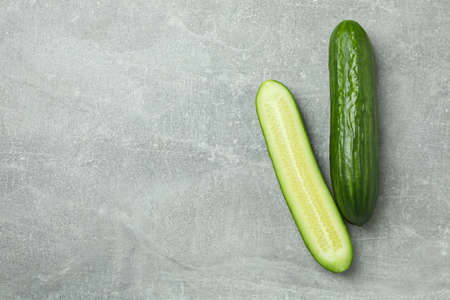 Ripe cucumbers on gray background, space for textの写真素材