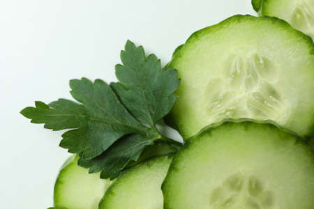 Fresh ripe cucumber slices on white backgroundの写真素材