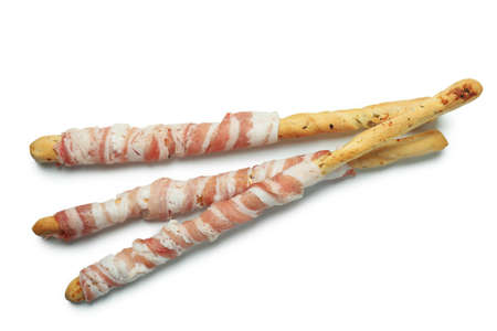 Grissini sticks with bacon isolated on white background