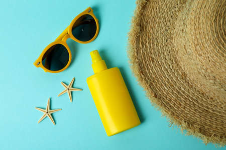 Summer concept with sunscreen on blue backgroundの写真素材